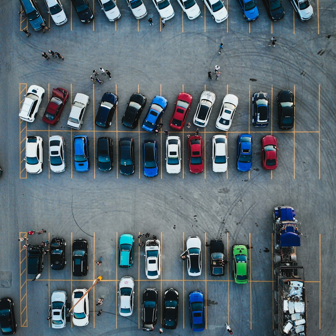 cars parked on parking lot during daytime cars parked on parking lot during daytime